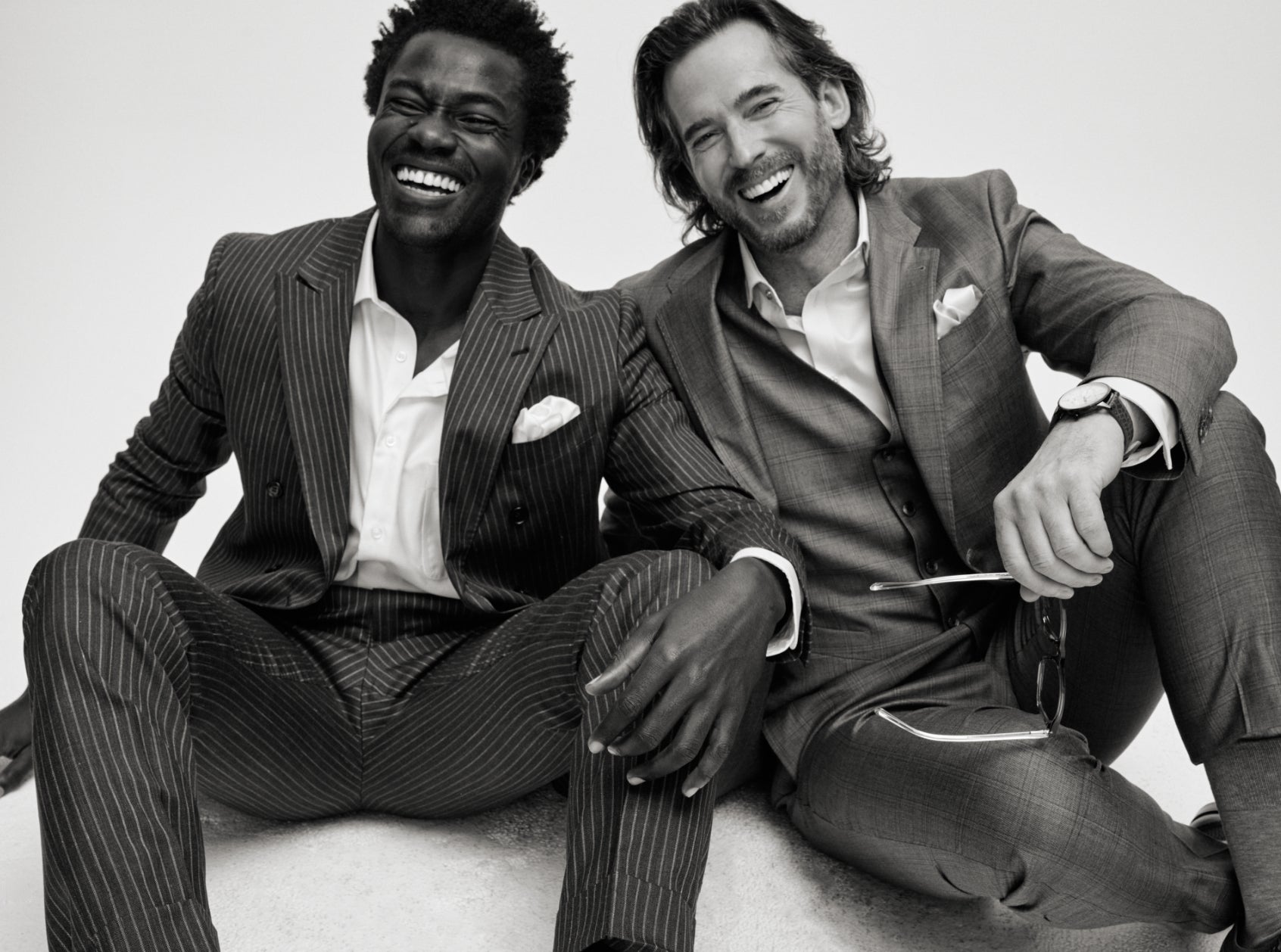 two men sitting, wearing Joseph Abboud 